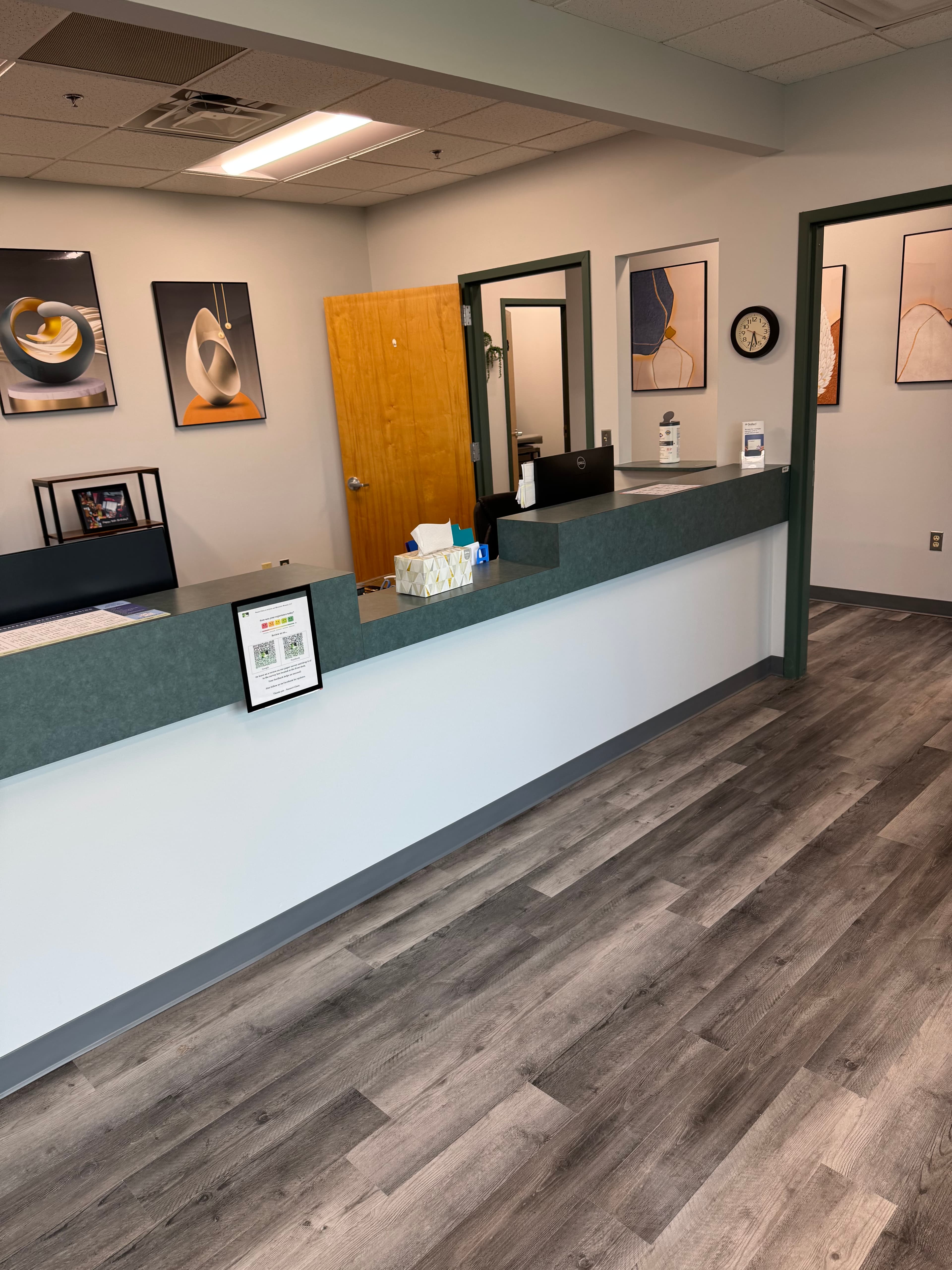 Commercial office reception area renovation with custom counter and luxury vinyl flooring in DC by Atlantic Construction