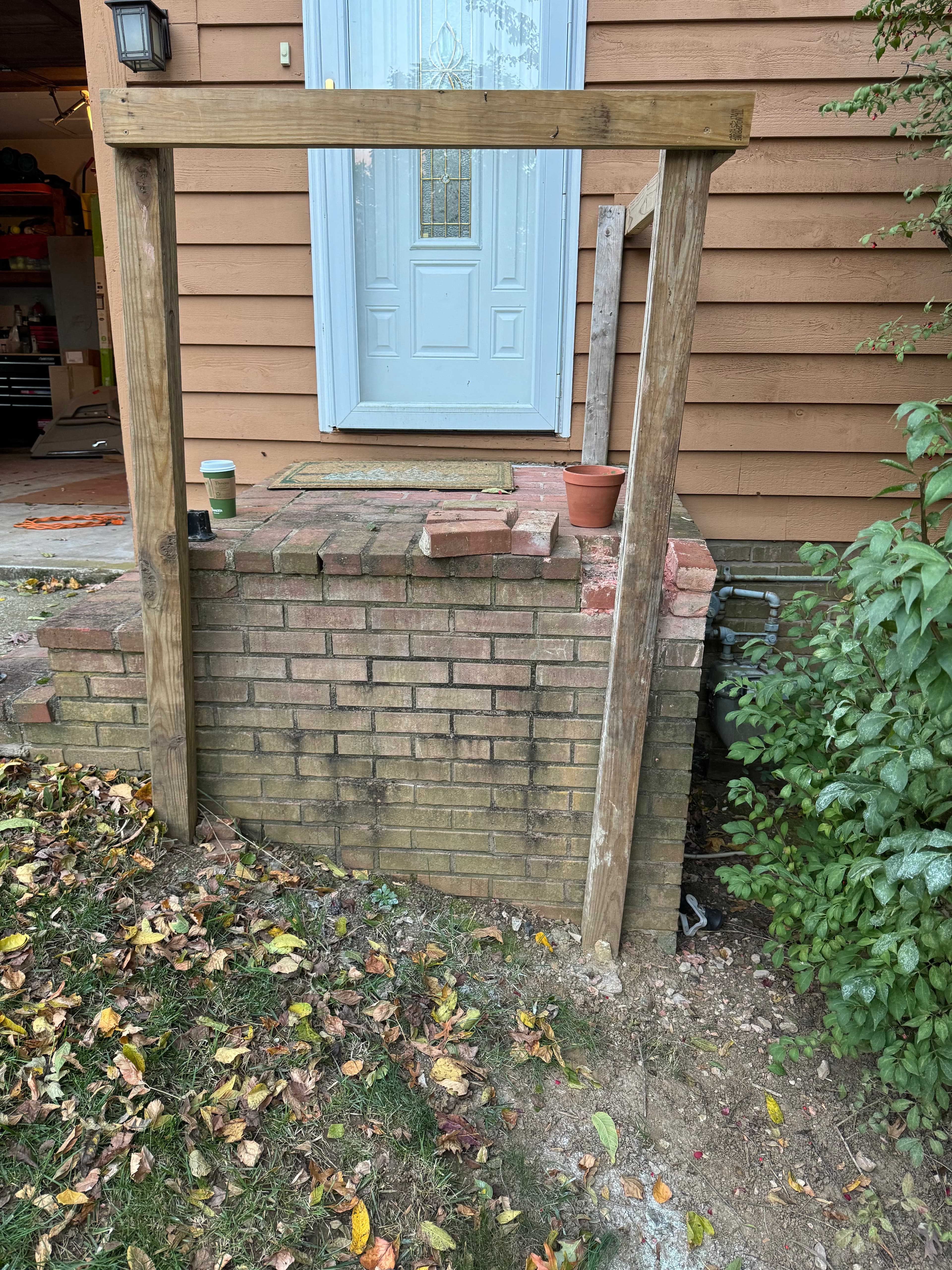 Brick masonry entry steps and pergola before repair in Maryland by Atlantic Construction