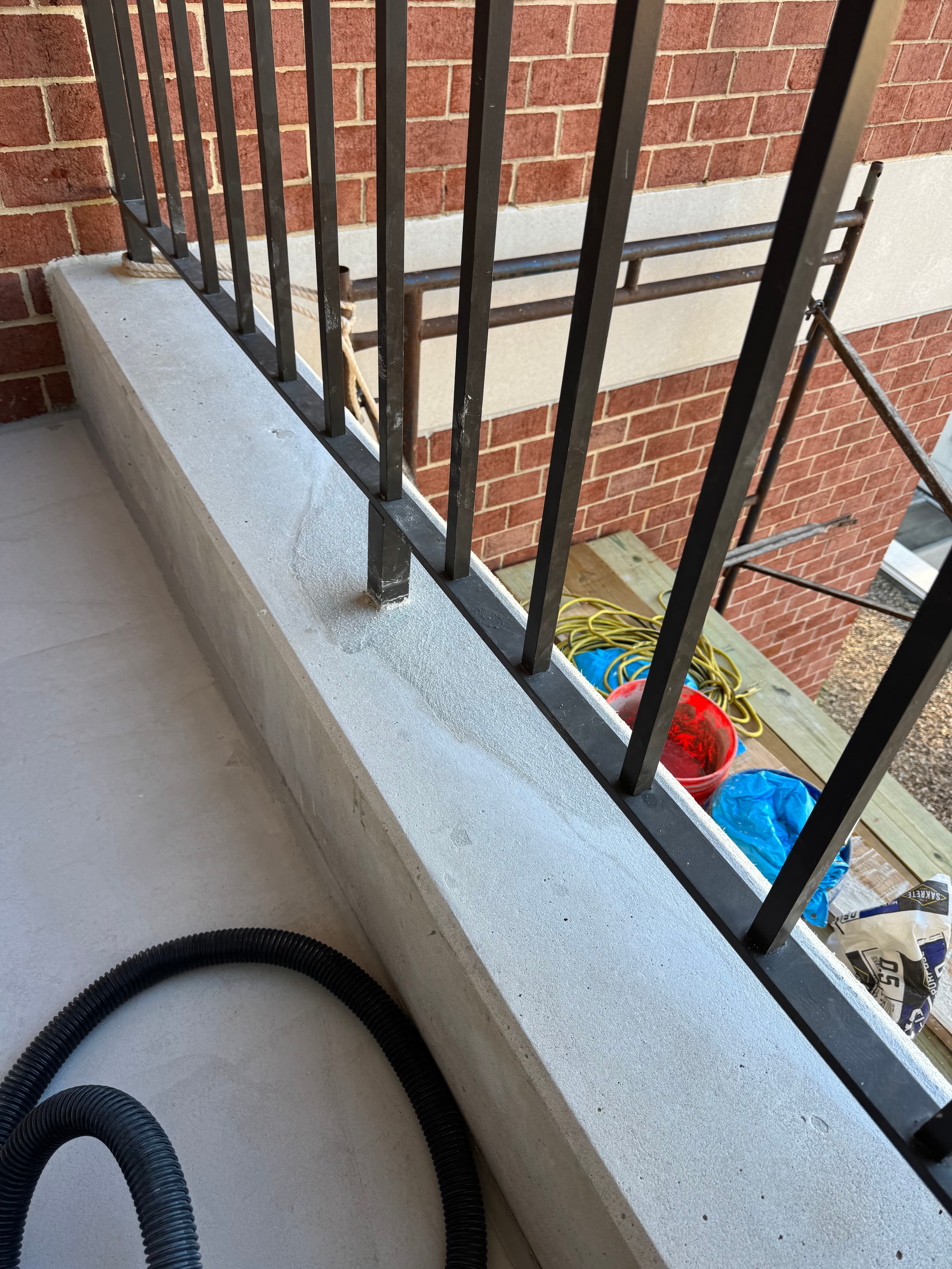 Commercial concrete balcony and railing installation in progress in DC by Atlantic Construction