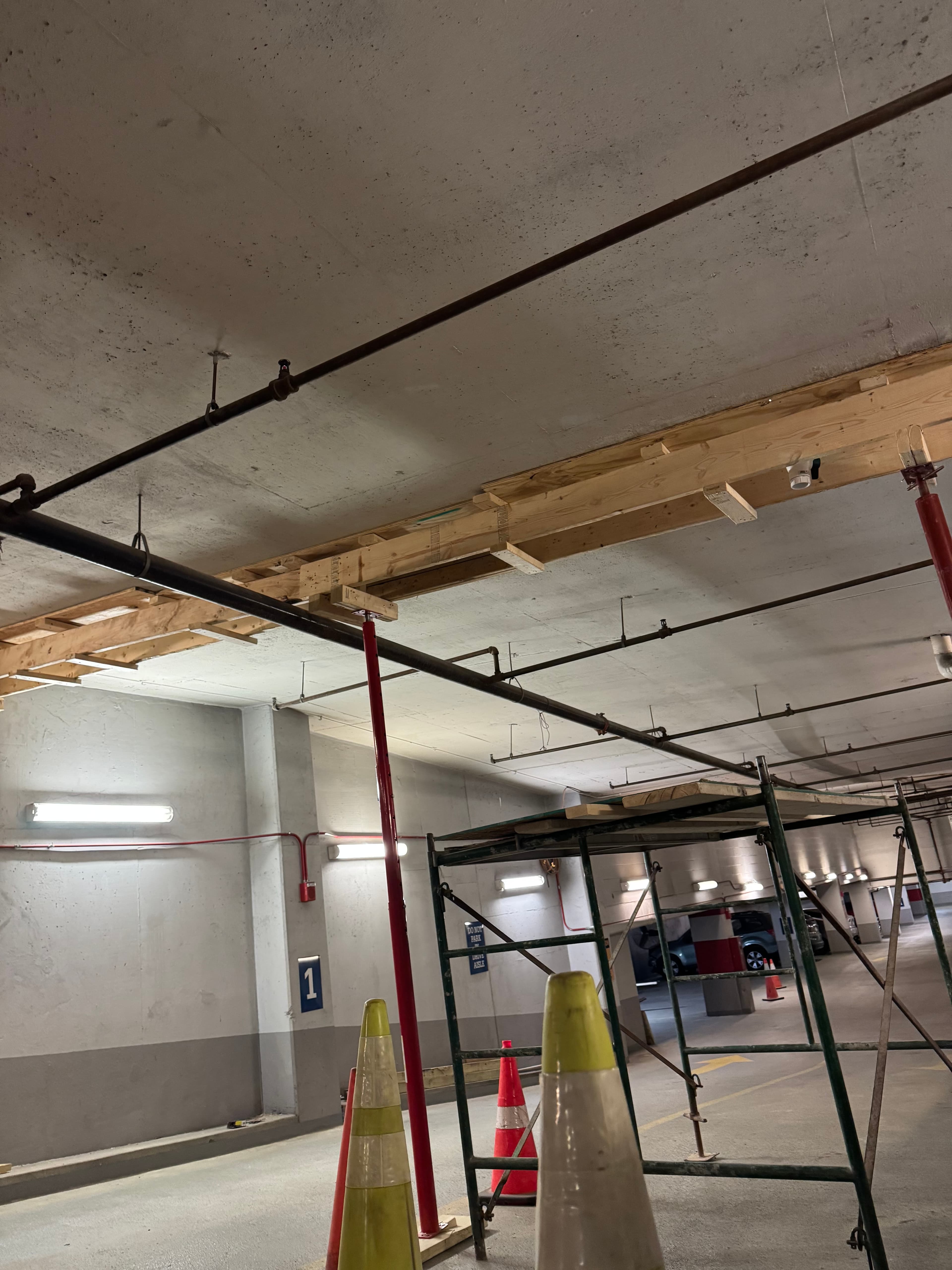 Commercial parking garage wood joist installation over concrete ceiling in DC by Atlantic Construction