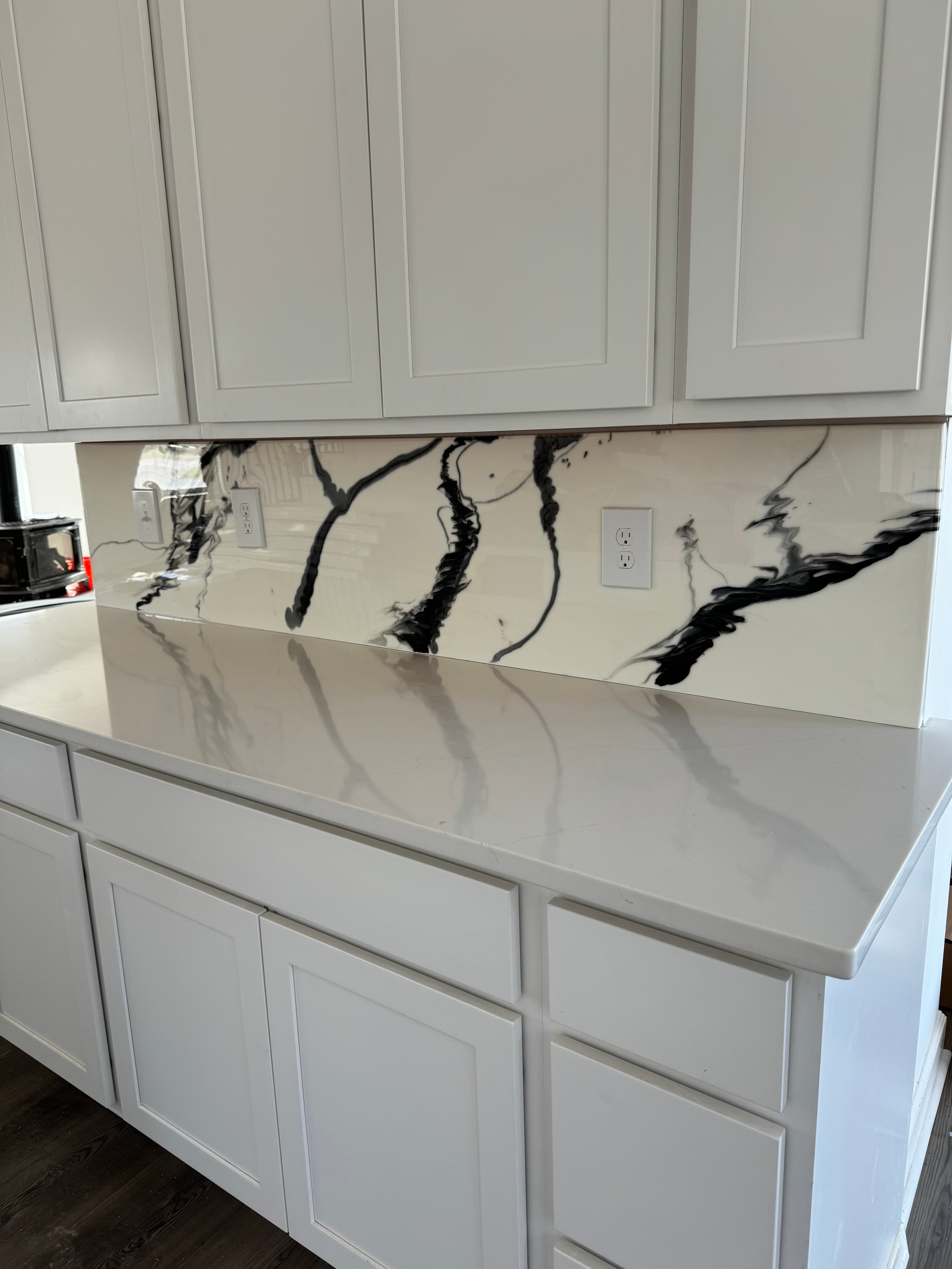 Luxury white kitchen with dramatic marble countertops in Maryland by Atlantic Construction